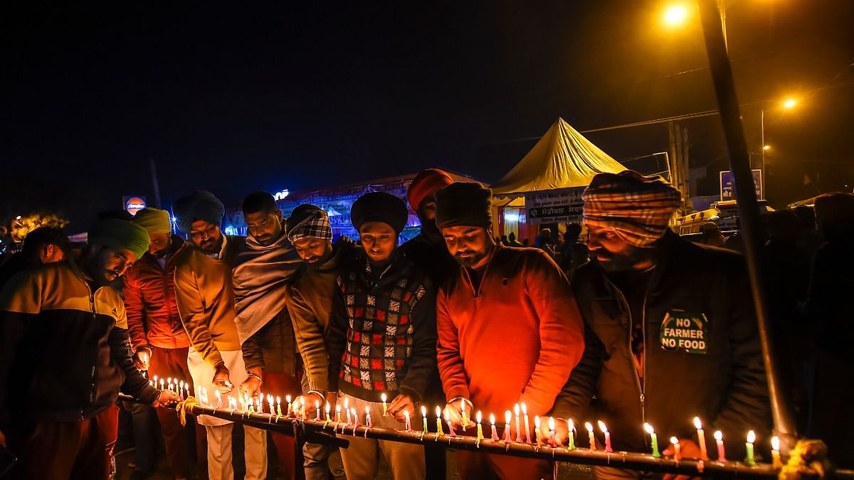 December 20 | Owing to different reasons many farmers lost their lives while protesting the Centre's three farm laws. A candlelight vigil was held to honour their lives | Credit: PTI File Photo