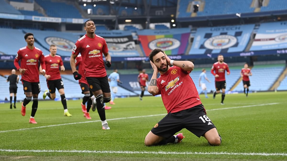 Manchester United's Bruno Fernandes celebrates scoring their first goal during a 2-0 win over Manchester City in the Manchester Derby. Credit: Reuters Photo