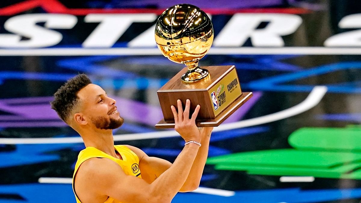 Golden State Warriors guard Stephen Curry (30) celebrate after winning the NBA All-Star 3 Point Contest at State Farm Arena. Credit: Reuters Photo