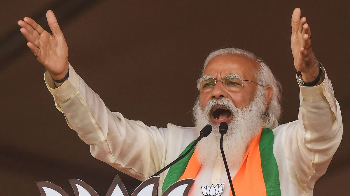 Prime Minster Narendra Modi addresses supporters of the Bharatiya Janata Party (BJP) during a mass rally ahead of the state legislative assembly elections at the Brigade Parade ground in Kolkata. Credit: AFP Photo