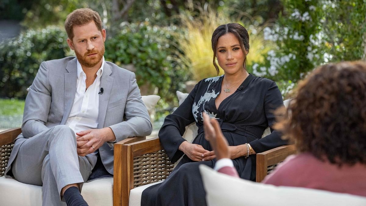 Britain's Prince Harry (L) and his wife Meghan (C), Duchess of Sussex, in a conversation with US television host Oprah Winfrey. Credit: AFP Photo