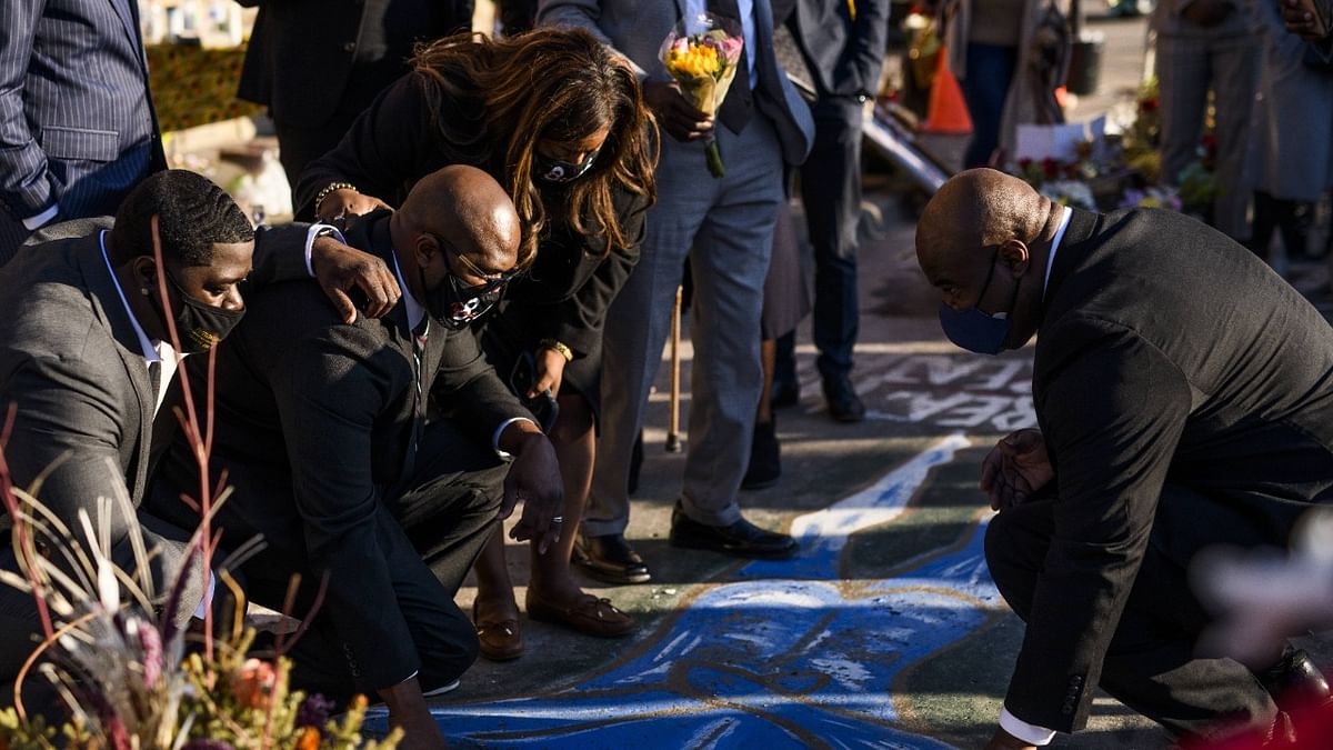 Family members of George Floyd, Brandon Williams (L), Philonese Floyd, Keeta Floyd, and Rodney Floyd visit the site where he was killed last year in Minneapolis, Minnesota. Credit: AFP Photo