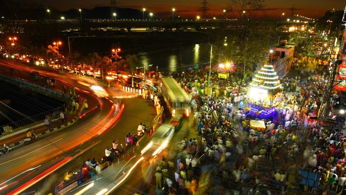 Devotees participate in the annual chariot procession 'Rathotsavam', in Vijayawada. Credit: PTI Photo