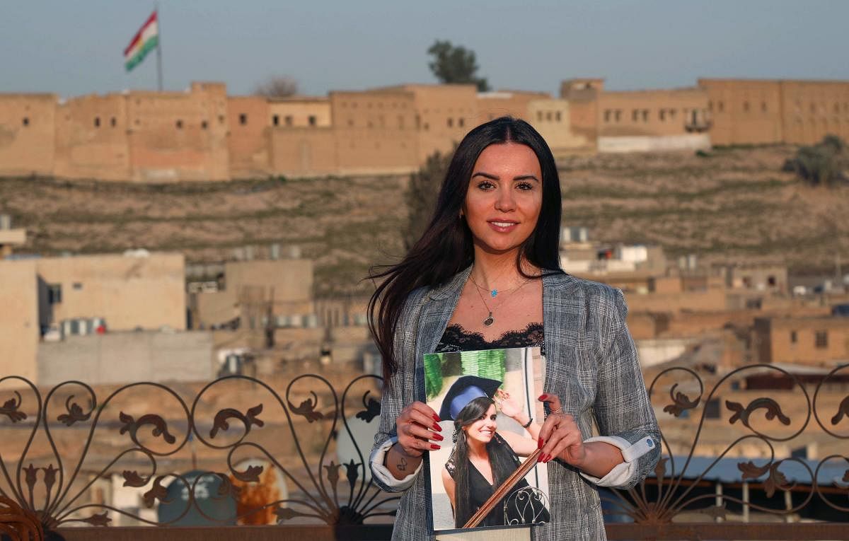 In Iraqi Kurdistan, Dima al-Kaed, 29, clutched a memento of her graduation, one of the few belongings she kept after her family moved from Damascus and sold their home.