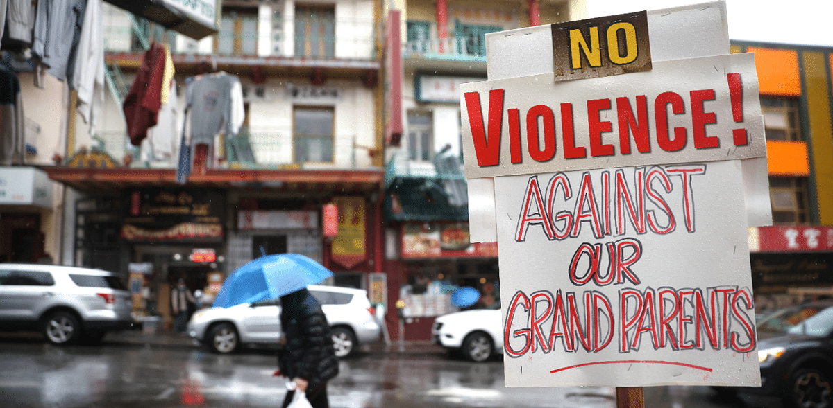 A signs against violence against Asians is posted in front of a store in Chinatown on March 18, 2021 in San Francisco, California. Credit: AFP Photo