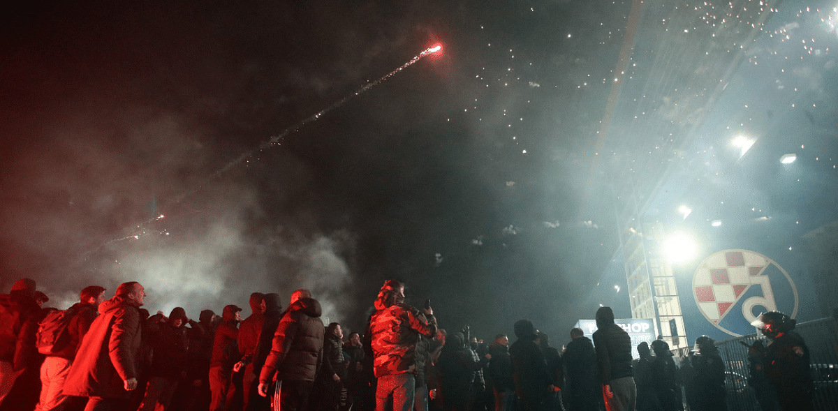 Supporters gather and light fireworks to celebrate in front of the stadium after Dinamo Zagreb won the UEFA Europa League round of 16 first leg football match against Tottenham Hotspur at the Maksimir Stadium in Zagreb, on March 18, 2021. Credit: AFP Photo