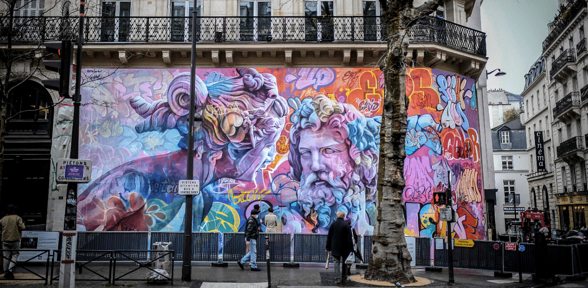 A mural painted by Antonio Sanchez Santos aka Pichi and Alvaro Hernandez Santaeulalia aka Avo, members of the Spanish street artist duo PichiAvo, is pictured on a wall on Saint-Michel boulevard in central Paris. Credit: AFP Photo