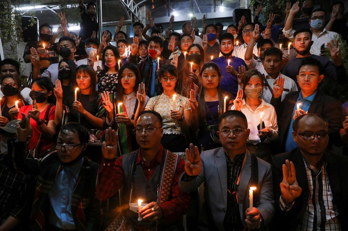 Myanmar citizens living in India and members of Mizo Zirlai Pawl (MZP), a student organisation from India's Mizoram state, hold a candle vigil to pay tribute to people who died in Myanmar after the military coup, in New Delhi, India. Credit: Reuters Photo