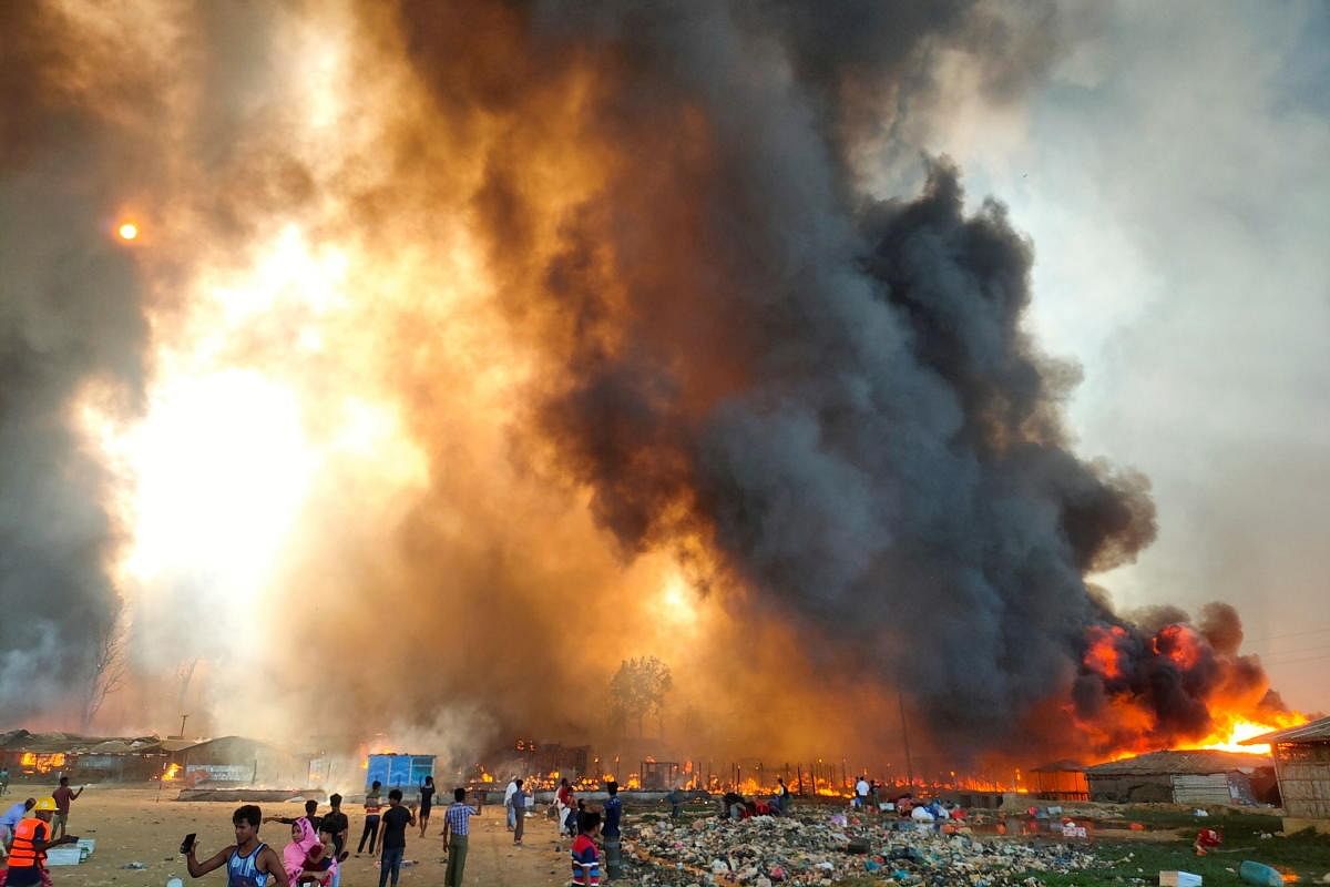 Smoke billows at the site of the Rohingya refugee camp where fire broke out in Cox's Bazar. Credit: Reuters Photo