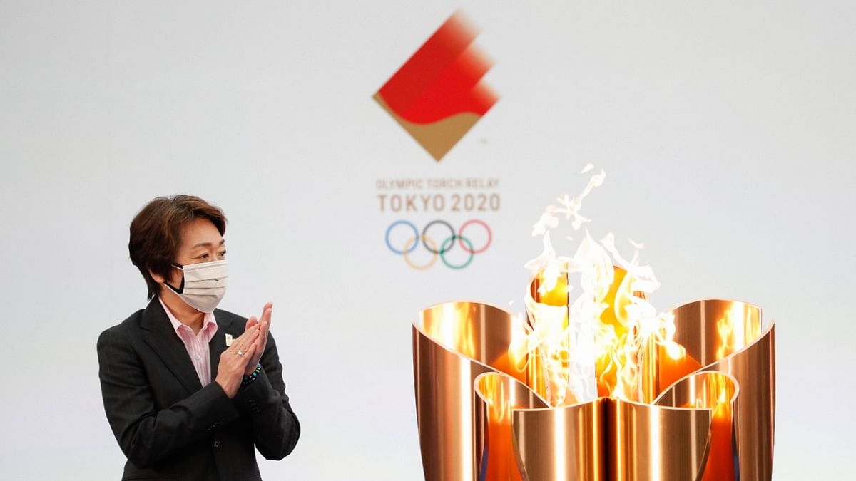 The rose-gold, cherry blossom-shaped torch is lit at the J-Village sports complex in Fukushima, which served as a base for operations responding to the 2011 nuclear disaster, but no spectators are allowed at the launch. The flame will traverse the country borne by 10,000 runners and passing through all 47 prefectures before arriving for the opening ceremony. Credit: AP/PTI Photo