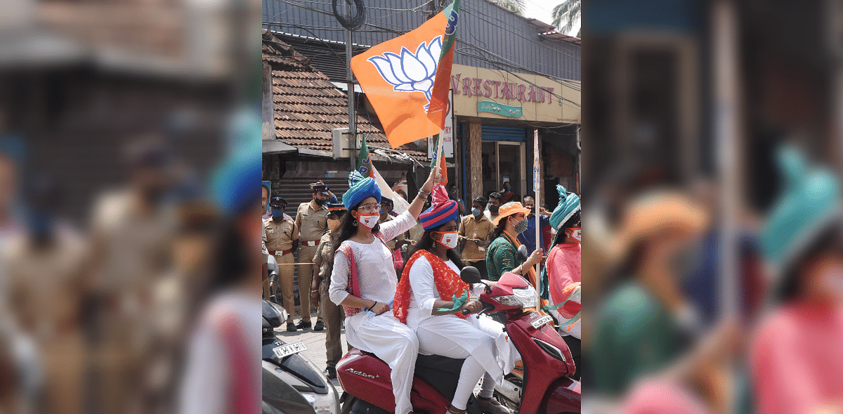 BJP supporters during Union Home Minister Amit Shah's election campaign for the upcoming state assembly elections, at Thripunithura in Kochi on March 24. Credit: PTI Photo