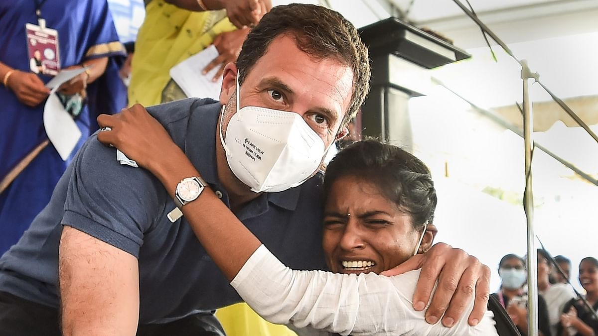 Congress leader Rahul Gandhi poses for photographs with a student during his visit to Bharathidasan Government College for Women, in Puducherry, Wednesday, February 17, 2021. Credit: PTI File Photo