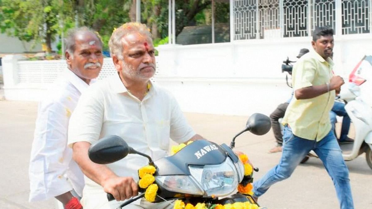 Former Chief Minister of Puducherry N.Rangasamy rides pillion with former Health Minister Malladi Krishna Rao during All India NR Congress election campaign ahead of the Assembly elections, in Puducherry, Thursday, March 18, 2021.  Credit: PTI File Photo