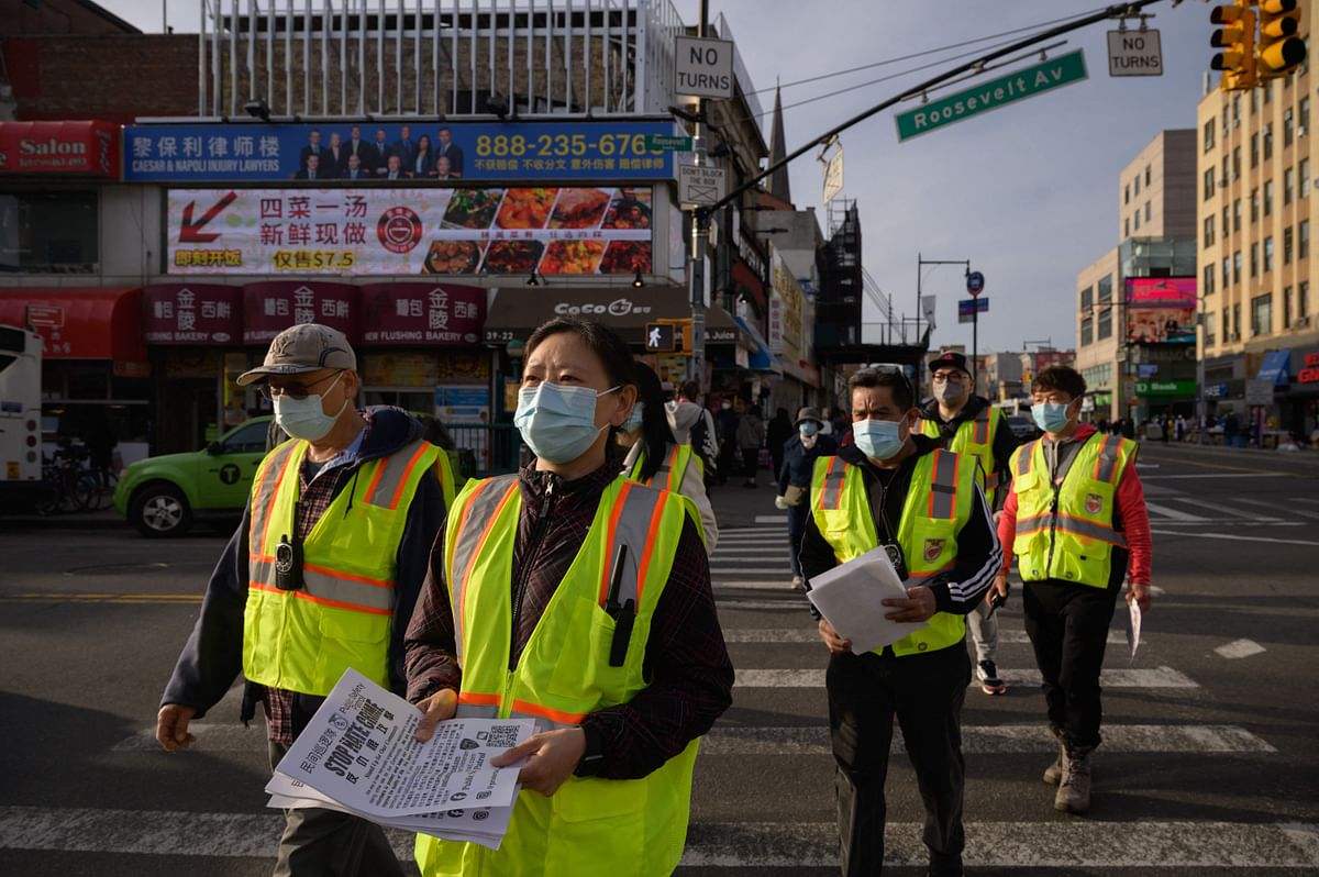 Public Safety Patrol, a volunteer anti-hate crime group, patrol in the Flushing neighborhood of Queens, New York. Credit: AFP Photo