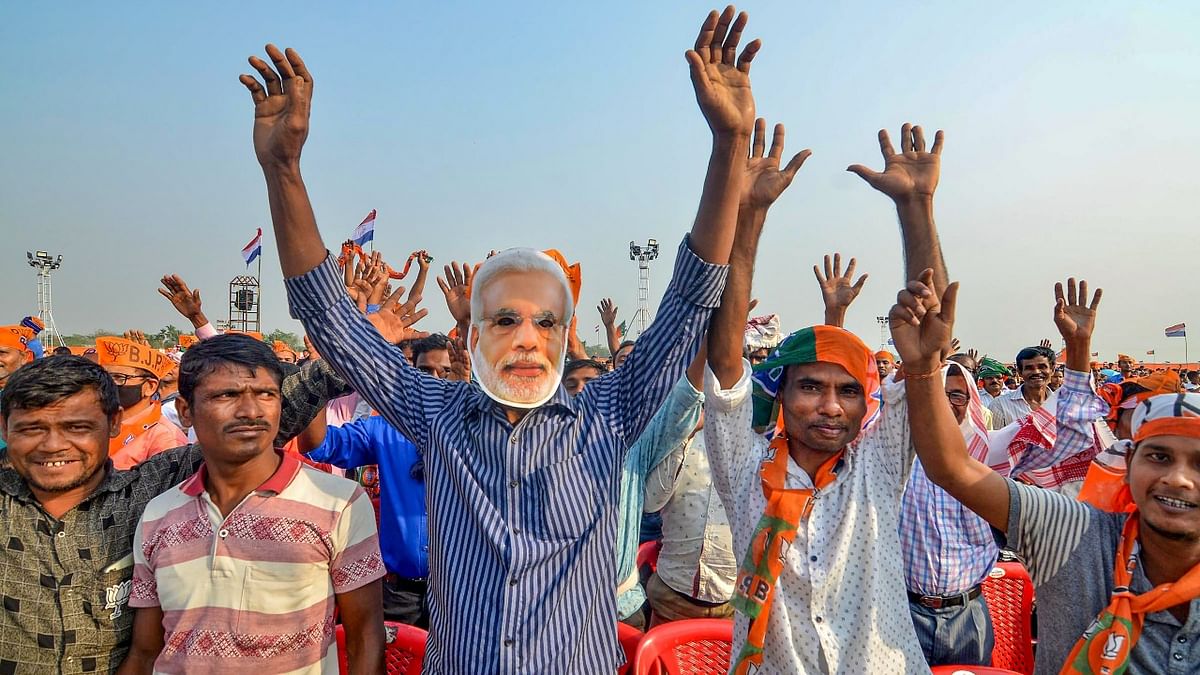 BJP supporters during Prime Minister Narendra Modi's election campaign rally ahead of the Assam Assembly polls , at Sipajhar in Darrang district, Wednesday, March 24, 2021. Credit: PTI File Photo