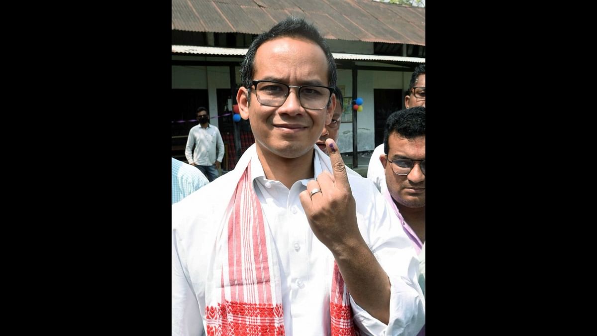 Congress MP Gourav Gogoi shows his finger marked with indelible ink after casting vote at a polling station, during the first phase of Assam Assembly elections, in Jorhat district. Credit: PTI Photo