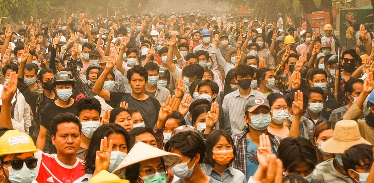 The three-finger salute has become a symbol of the resistance. Credit: AFP Photo