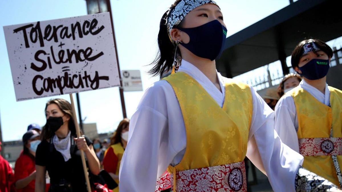 Performers and demonstrators march at the 'Stop Asian Hate March and Rally' in Koreatown on March 27, 2021 in Los Angeles, California. Credit: AFP.