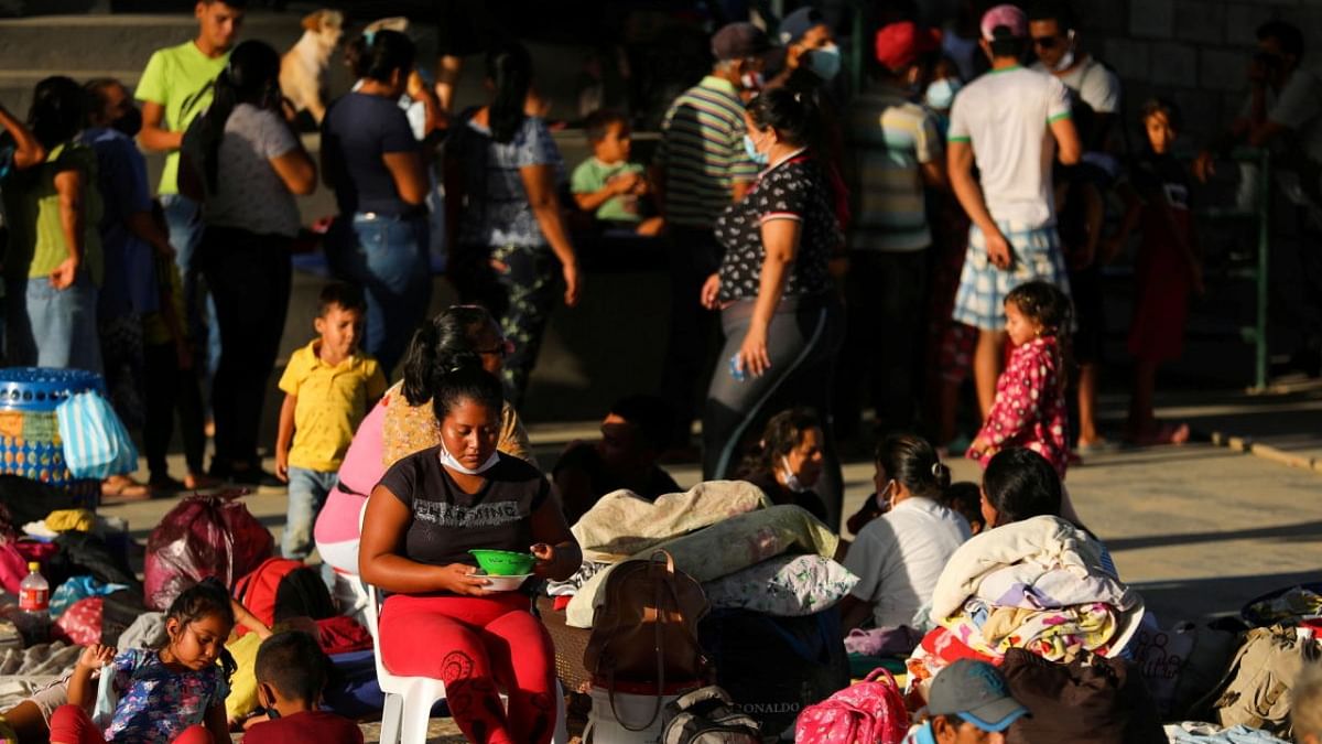 Venezuelan migrants are seen inside a coliseum where a temporary camp has been set up, after fleeing their country due to military operations, according to the Colombian migration agency, in Arauquita. Credit: Reuters.