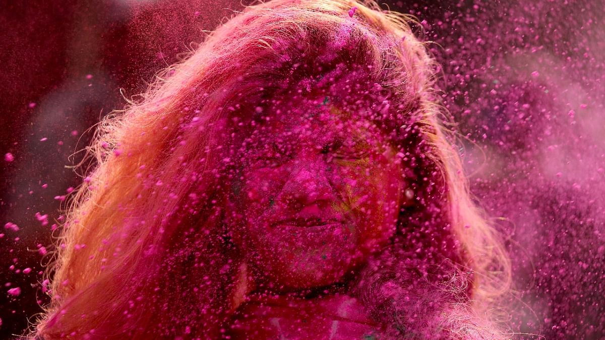Chennai: A woman daubed in colours during Holi celebrations. Credit: Reuters