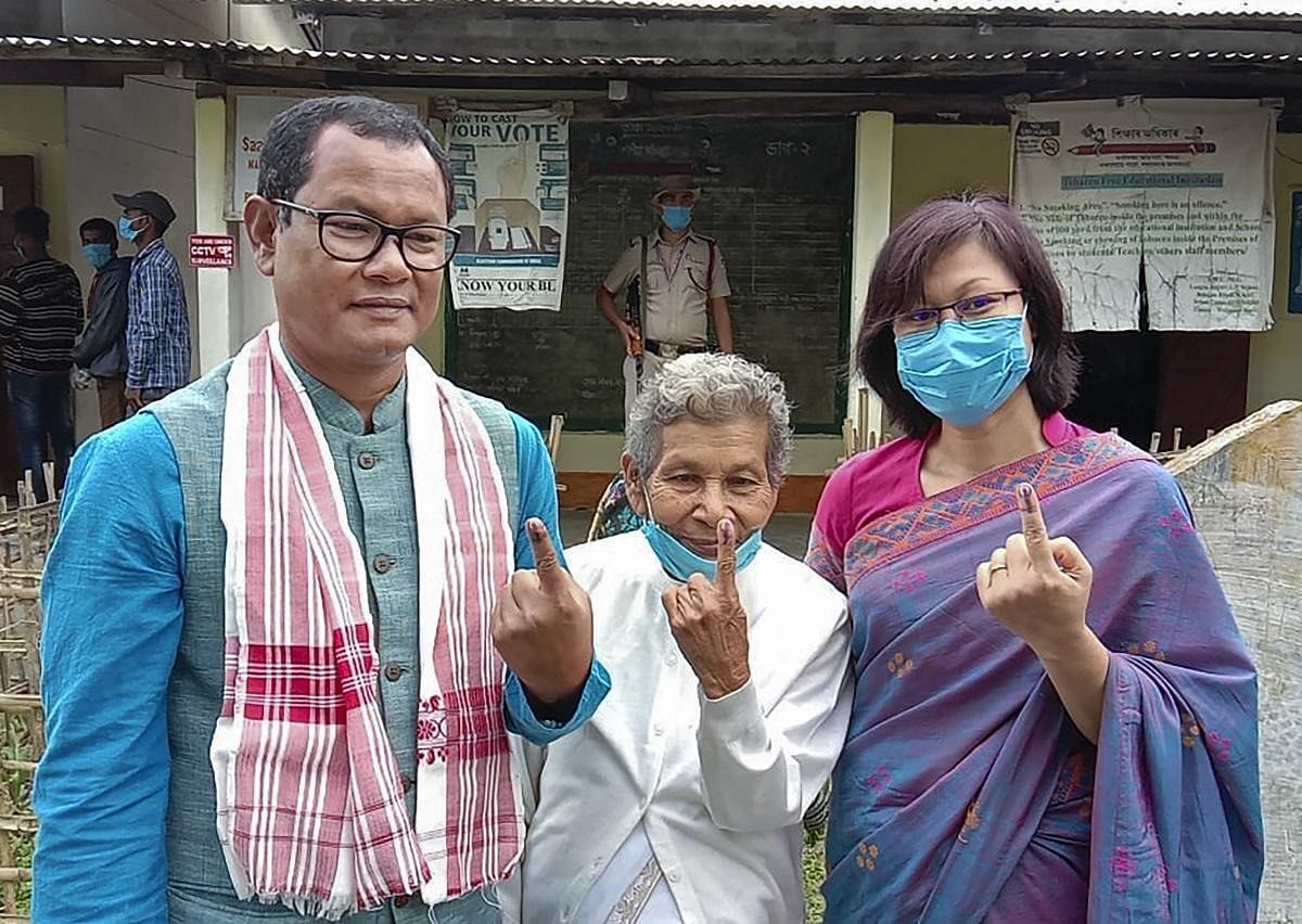 BJP candidate Numol Mumin shows his finger marked with indelible ink after casting his vote at a polling station, during the second phase of Assam Assembly Elections, at Boakjan in Karbi Anglong District. Credit: PTI Photo