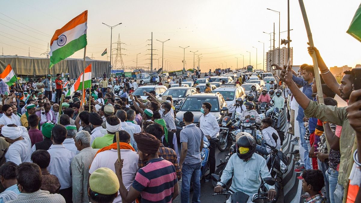 Farmers block traffic at Ghazipur border after Bharatiya Kisan Union (BKU) leader Rakesh Tikait's convoy was allegedly attacked in Rajasthan's Alwar, during their ongoing agitation against three farm laws, in New Delhi. Credit: PTI Photo