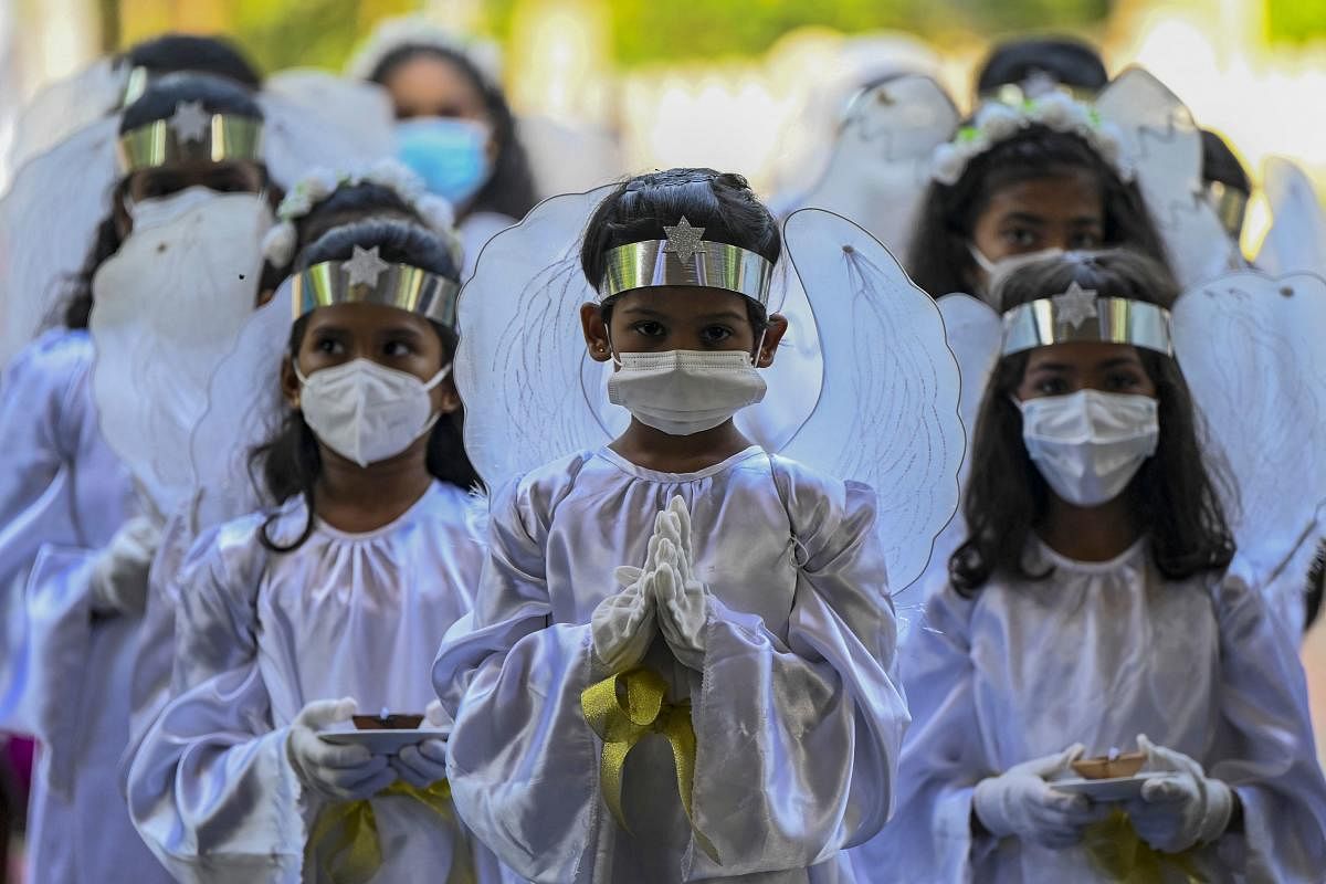 Young Christian devotees attend an Easter mass on the second anniversary of the Easter Sunday attack, at St. Sebastian's Church in Katuwapitiya on April 4, 2021. | AFP Photo