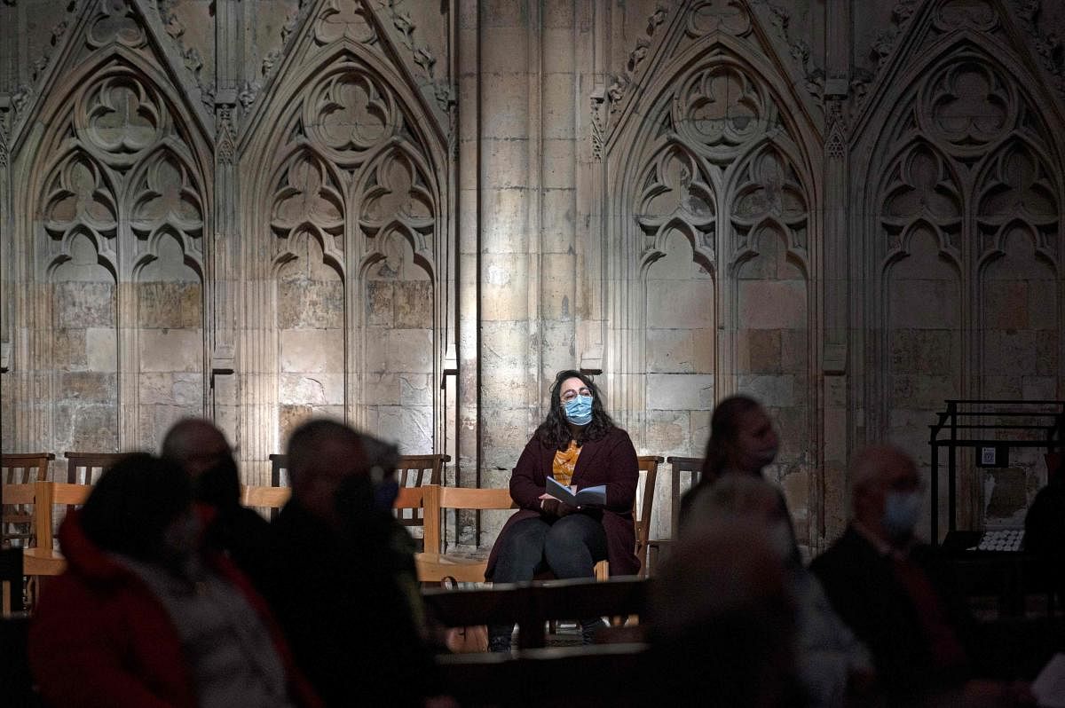 A socially distanced congregation listens as The Archbishop of York, The Most Reverend Stephen Cottrell, conducts the Festal Eucharist for Easter Day in York Minster, in York, northern England on April 4, 2021, his first Easter Sermon as Archbishop. | AFP Photo