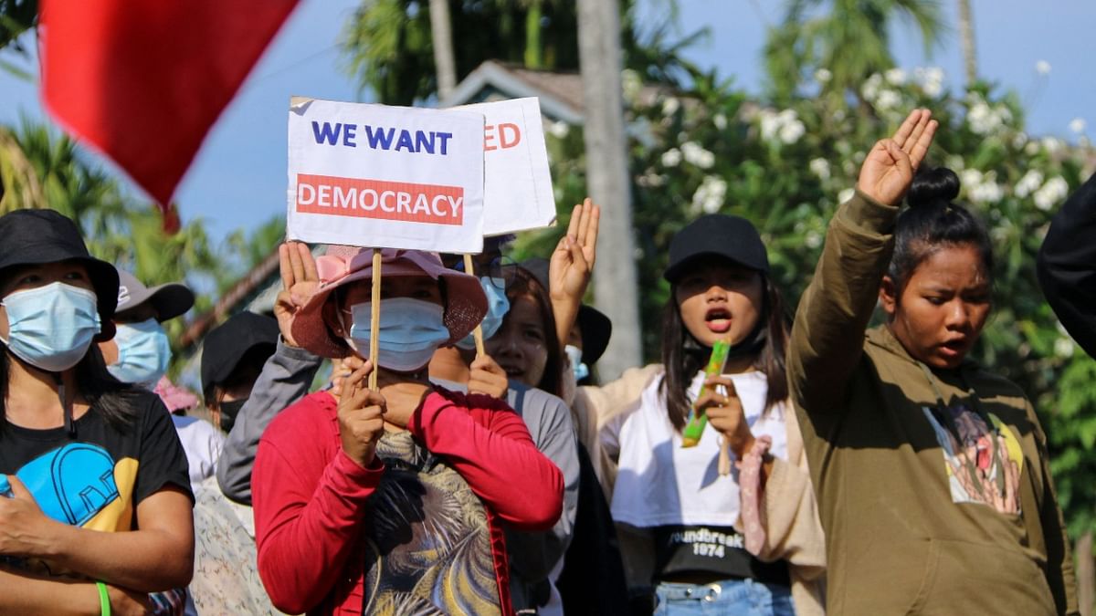 Protesters hold up the three finger salute during a rally against the military coup in Launglone township in Myanmar's Dawei district. Credit: AFP Photo