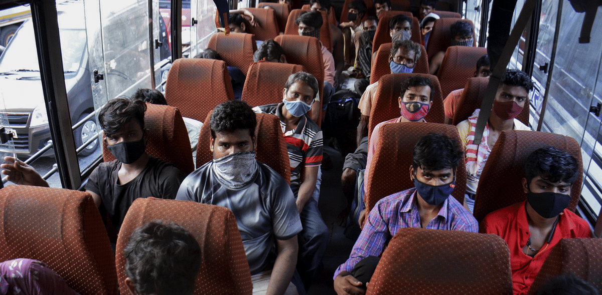 Migrant workers travel in a bus to leave for their home states from Thane, amid surge in Covid-19 cases. Credit: PTI Photo