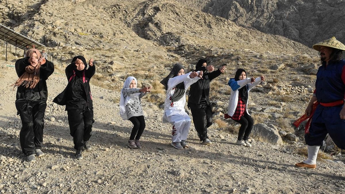 In this picture taken on January 31, 2021, Mubarak Ali Shan (R), a martial arts instructor trains female students of the Hazara community during a self-defence martial arts training class, on the outskirts of Quetta. Credit: AFP.