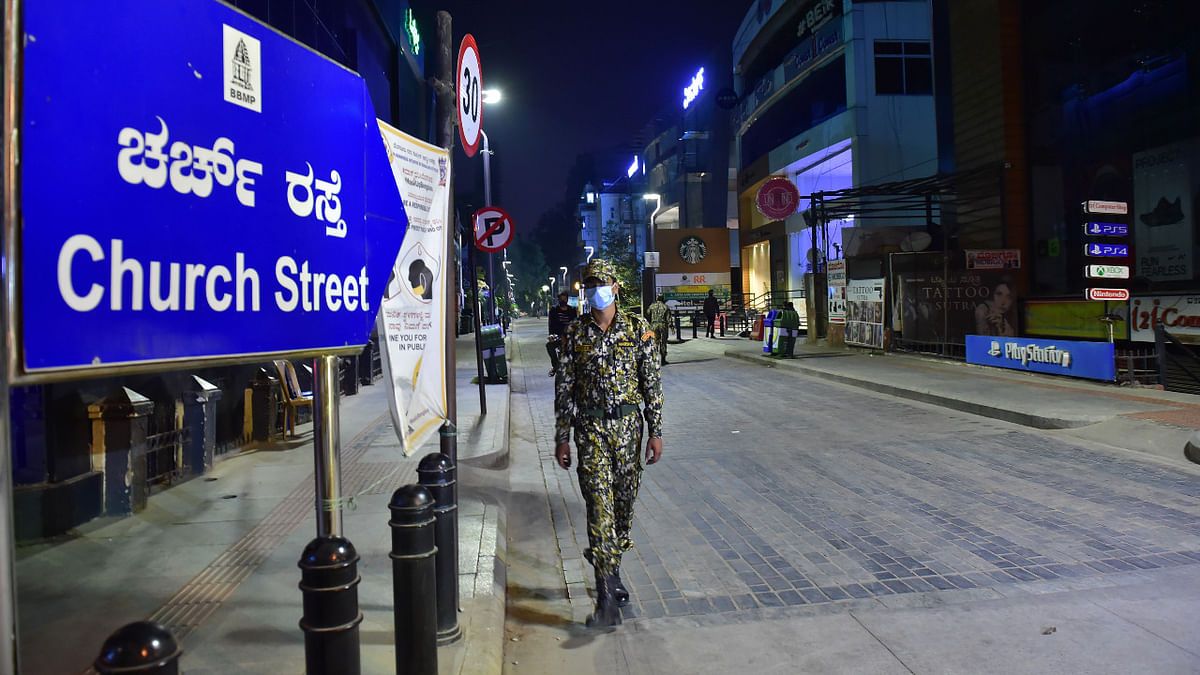 Bengaluru's Church Street wears a deserted look on the first day of the imposed night curfew across Karnataka. Credit: PTI Photo