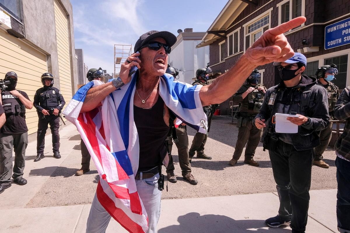 A demonstrator argues with others during a White Lives Matter protest in Huntington Beach, California, U.S. Credit: Reuters Photo