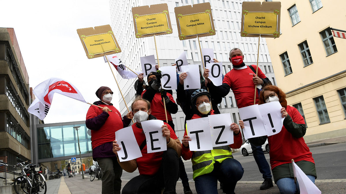 Hospital employees participate in a protest in demand of adequate personnel requirements in front of the Charite hospital in Berlin. Credit: Reuters Photo