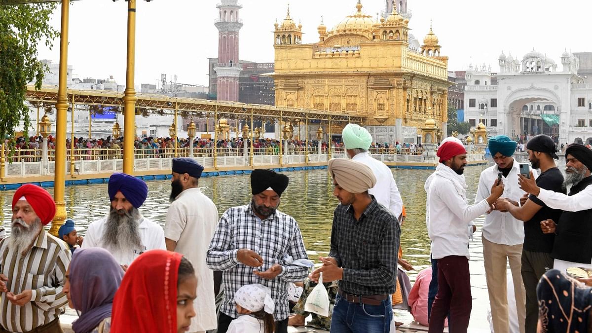 Sikh devotees visit the Golden Temple on the occasion of Baisakhi festival in Amritsar.