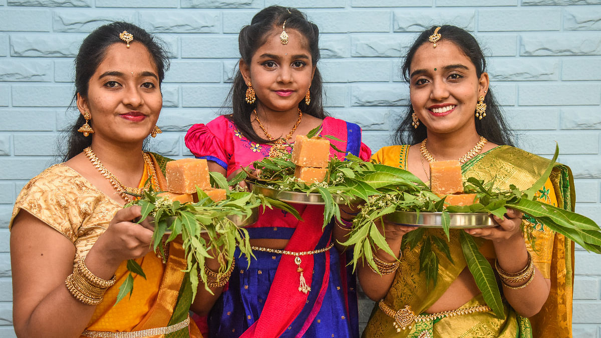 New Beginning: Girls with mango leaves, Neem flower (Bevu) and Jaggery (Bella), all set to welcome the New Year, during Ugadi festival celebrations in Bengaluru. Credit: DH Photo/S K Dinesh
