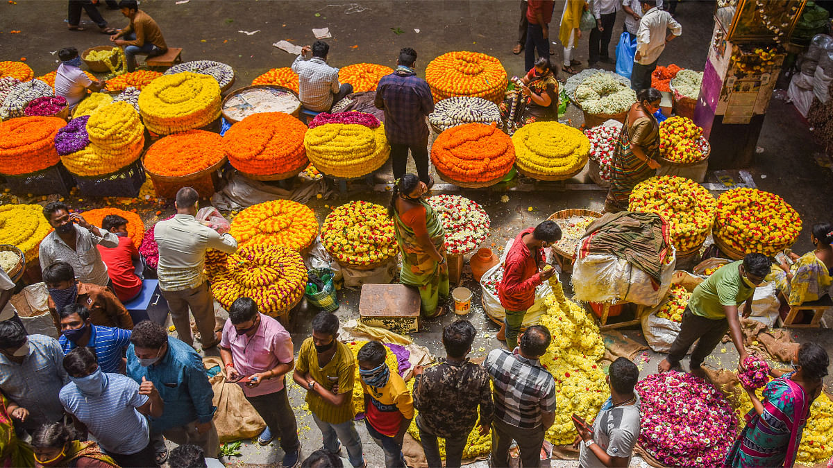 Vendors sell flowers ahead of the Ugadi festival at K R Market in Bengaluru. Credit: DH Photo/ S K Dinesh