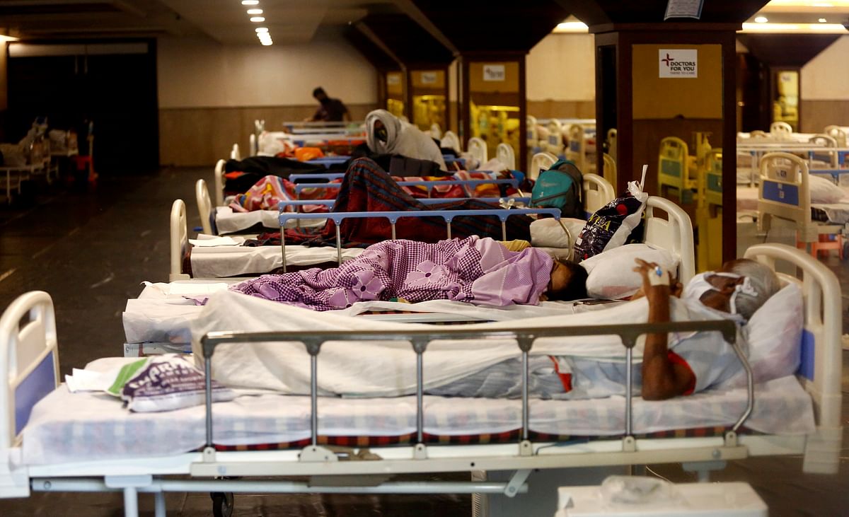Covid-19 patients admitted for treatment in emergency Covid care center at Shahnai banquet hall in front of LNJP hospital in New Delhi. Delhi recorded over 10,000 cases on Monday. Credit: PTI Photo