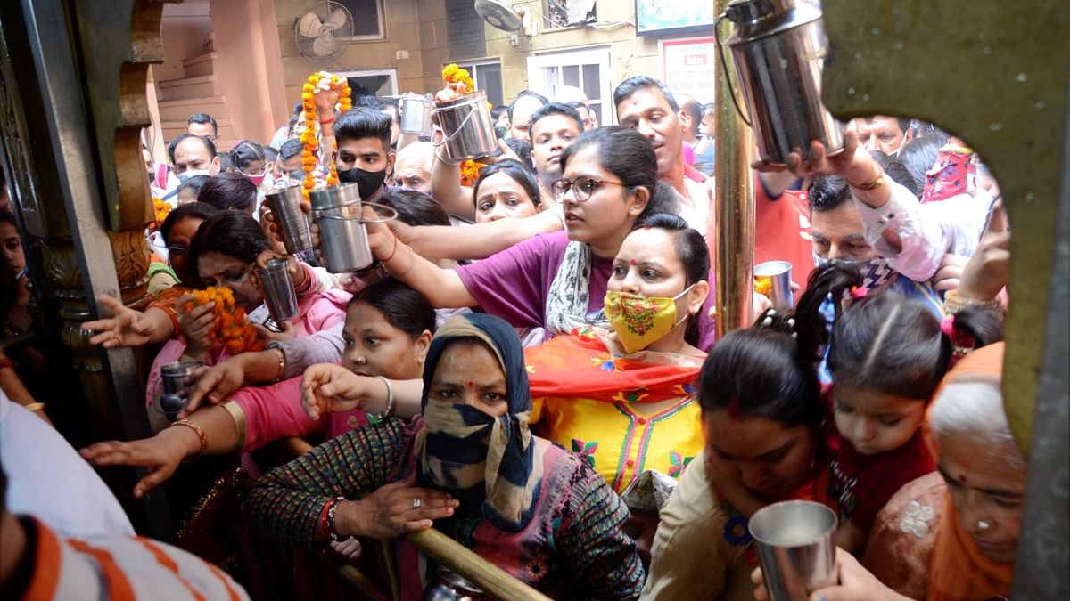 Devotees offer prayers at Longa Wali Devi Temple on the first day of Navratri celebrations, during the ongoing coronavirus pandemic, in Amritsar.
