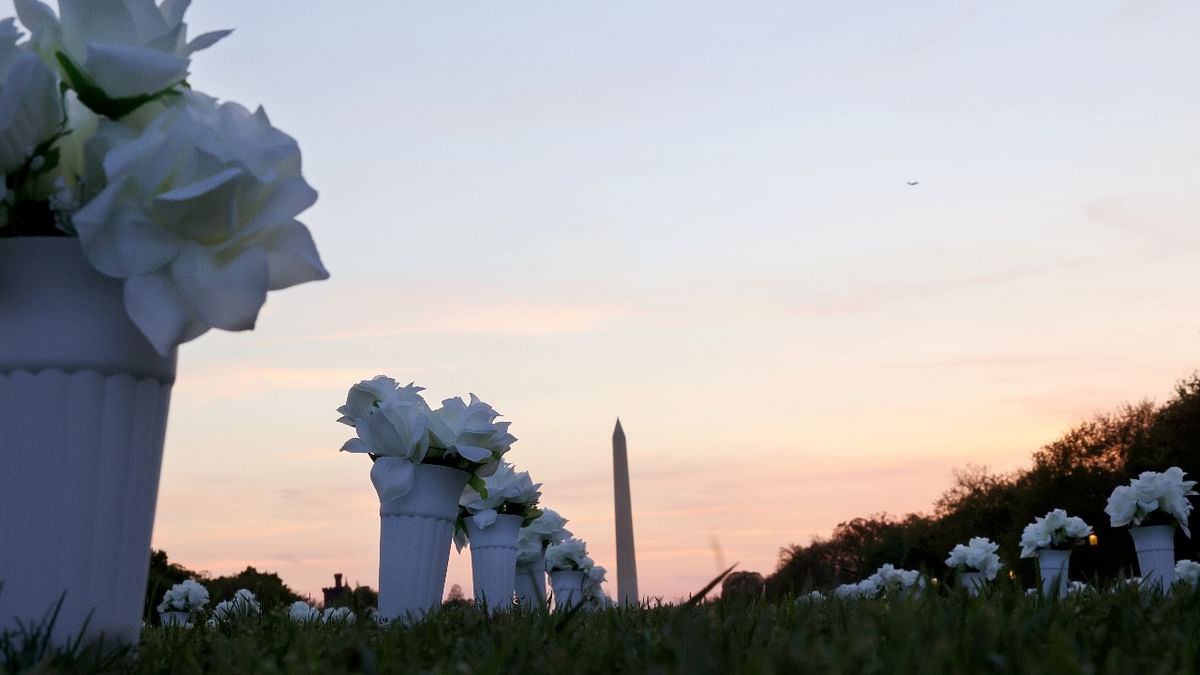 new memorial installed by Giffords, a gun violence prevention organization, and featuring 38,000 silk white roses in 4,000 vases to commemorate the roughly 40,000 Americans who die annually from gun violence, is seen on the National Mall in Washington. Credit: Reuters photo