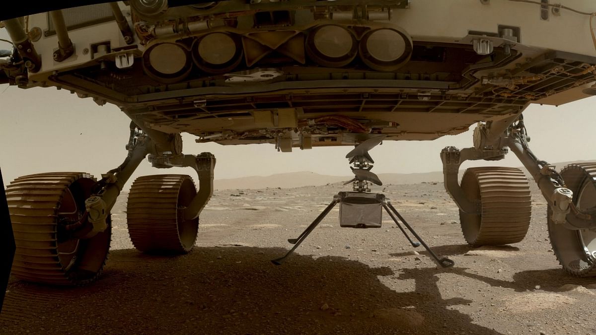 This NASA photo obtained on April 6, 2021, shows NASA’s Ingenuity Mars Helicopter with all four of its legs deployed before dropping from the belly of the Perseverance rover on March 30, 2021. Credit: Handout/NASA/JPL-CALTECH / AFP photo