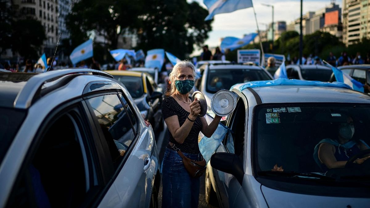 People protest against Argentine President Alberto Fernandez and the new restrictions to mitigate the spread of the novel coronavirus, at 9 de Julio Avenue in Buenos Aires. Credit: AFP photo