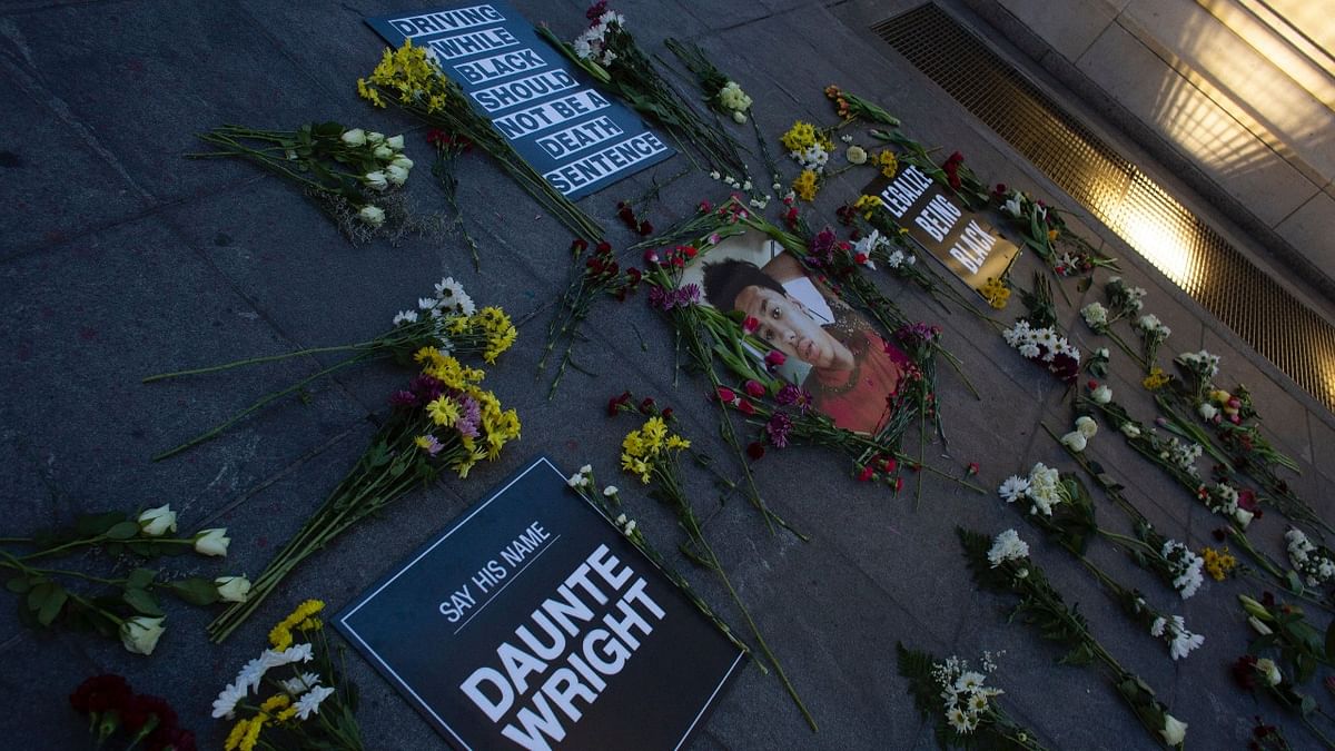 Flowers, candles and placards are seen at a makeshift memorial in honor of Daunte Wright, who was shot dead by a police officer in Minneapolis, in Washington Square, New York. Credit: AFP photo