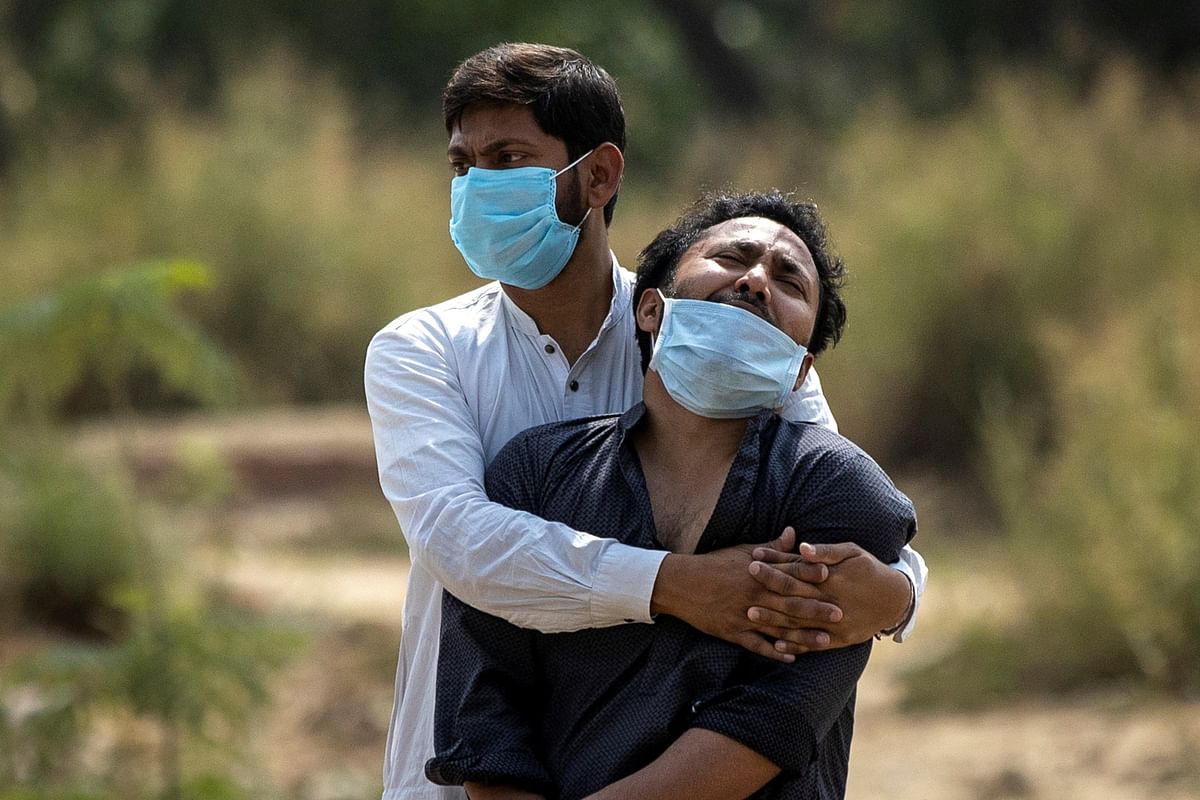 Families watched as their loved ones gasped for life, choked by the virus and with hospitals unable to take them. Credit: Reuters Photo