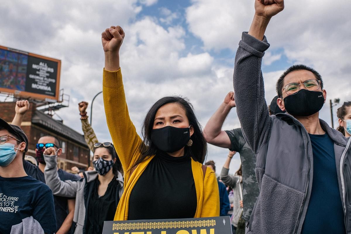 People participate in a chant during a demonstration in the intersection of 38th Street & Chicago Avenue on April 18, 2021 in Minneapolis, Minnesota. Credit: AFP photo.