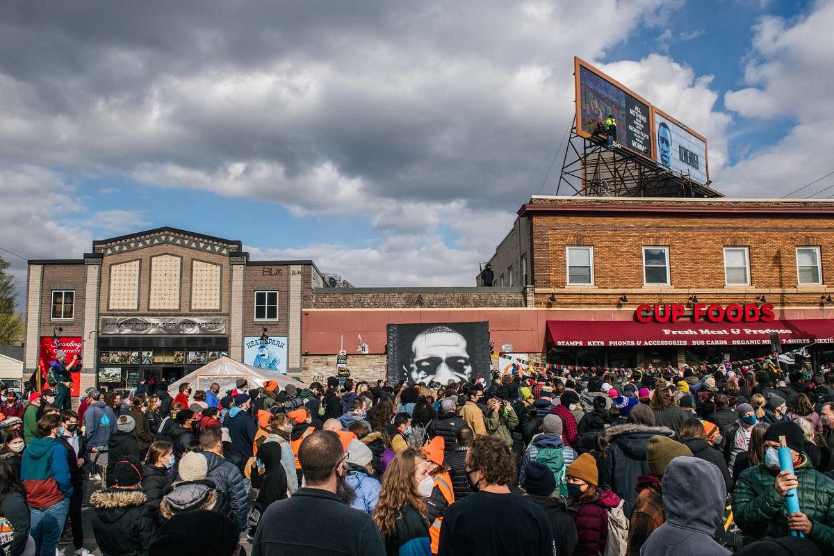 People gather at the intersection of 38th Street and Chicago Avenue to celebrate the guilty verdict in the Dereck Chauvin trail. Credit: AFP photo.