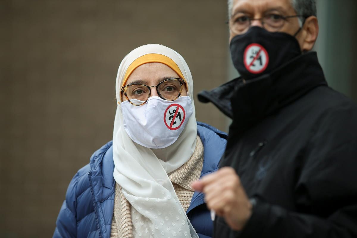 People attend a protest against Bill 21, after a court ruled that some teachers and provincial politicians are exempt from a controversial law that bans public employees from wearing religious symbols, in Montreal, Quebec, Canada. Credit: Reuters photo.