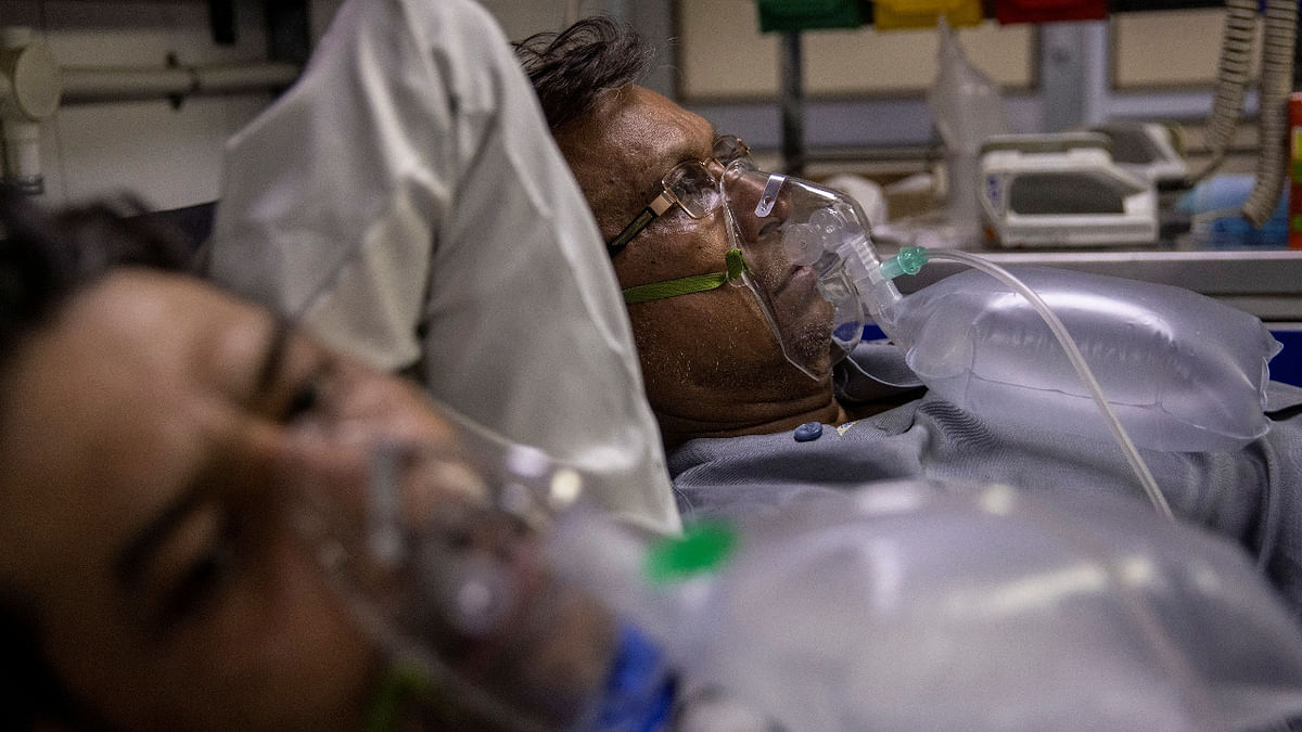 Patients suffering from the coronavirus disease get treatment at Delhi's LNJP Hospital. Credit: Reuters Photo