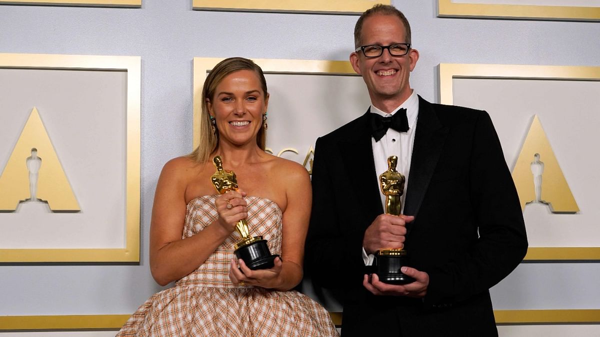 Dana Murray (L) and Pete Docter, winners of the award for animated feature film for