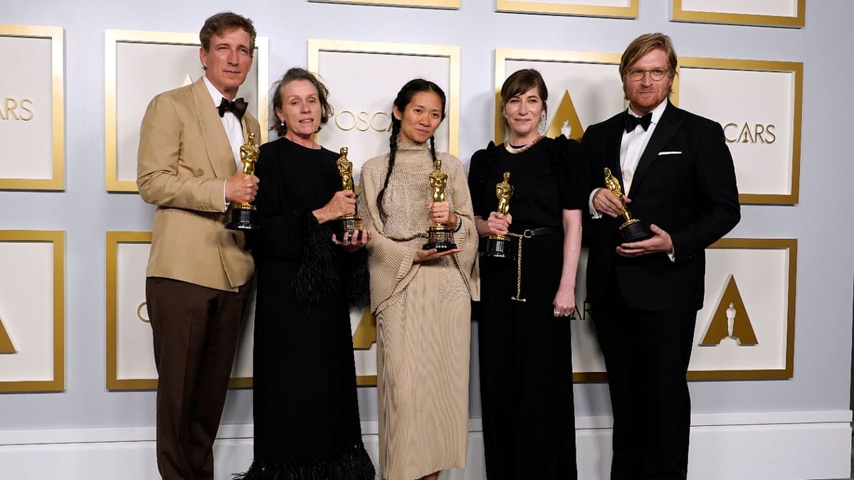\ Producers Peter Spears, from left, Frances McDormand, Chloe Zhao, Mollye Asher and Dan Janvey, winners of the award for best picture for